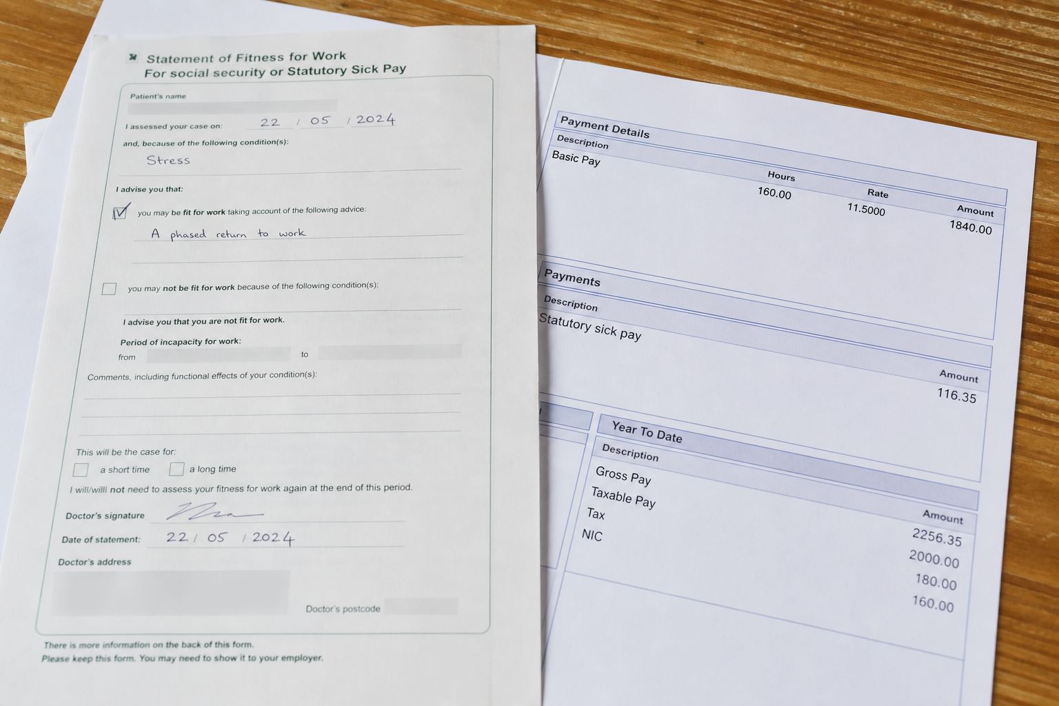 A fit note next to a payslip showing statutory sick pay.